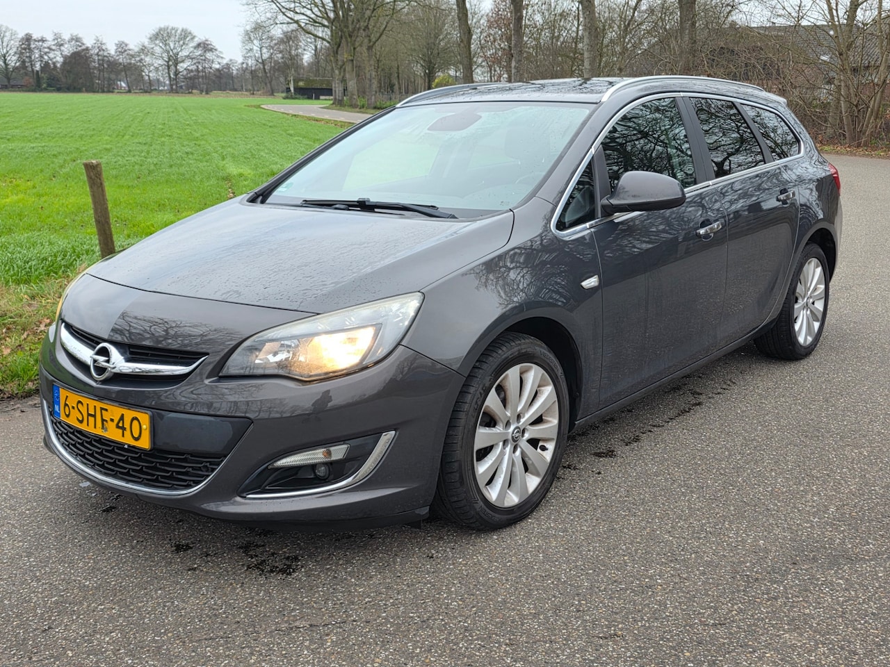 Opel Astra Sports Tourer - 1.4 Turbo Cosmo Zeer nette auto | 5drs | lange apk | airco | cruise | - AutoWereld.nl
