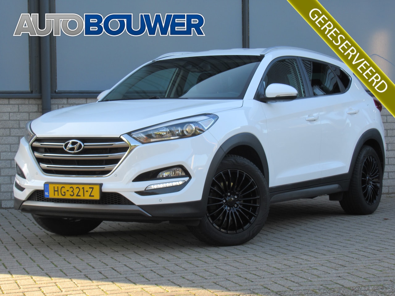 Hyundai Tucson - 1.6 GDi Comfort 2e eigen | dealer onderh | 18"inch velgen | navi | camera | tr.haak - AutoWereld.nl