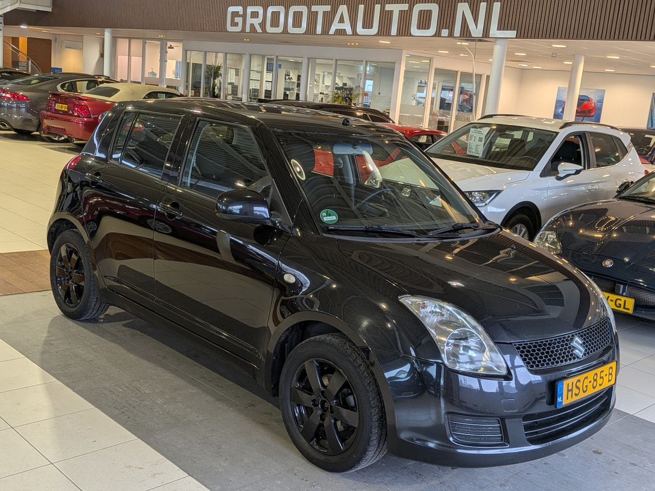 Suzuki Swift - 1.3 Comfort Airco, Stuurbekrachtiging - AutoWereld.nl