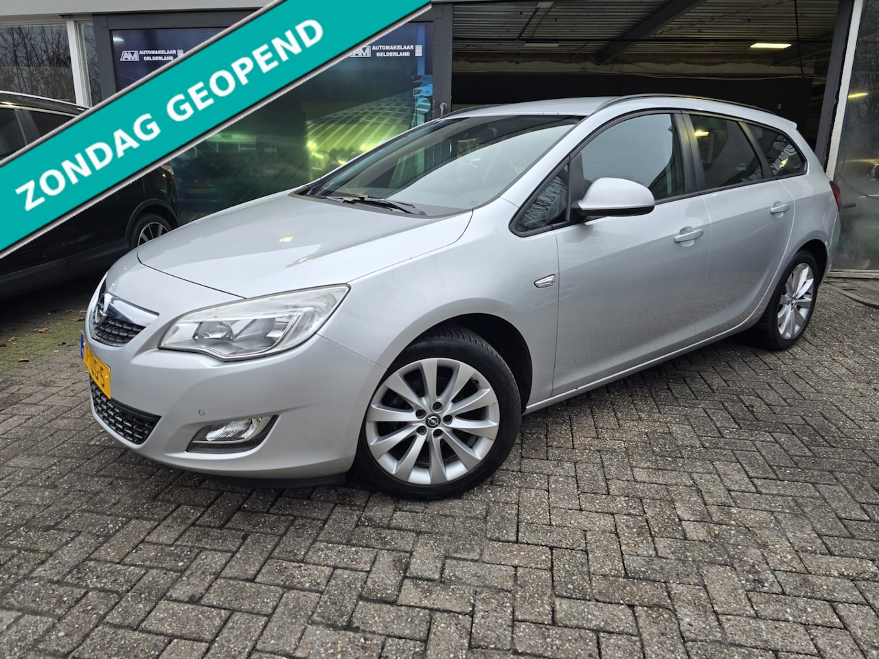 Opel Astra Sports Tourer - 1.4 Anniversary Edition | 2E EIGENAAR | 12MND GARANTIE | AIRCO | NAVI | CRUISE | - AutoWereld.nl