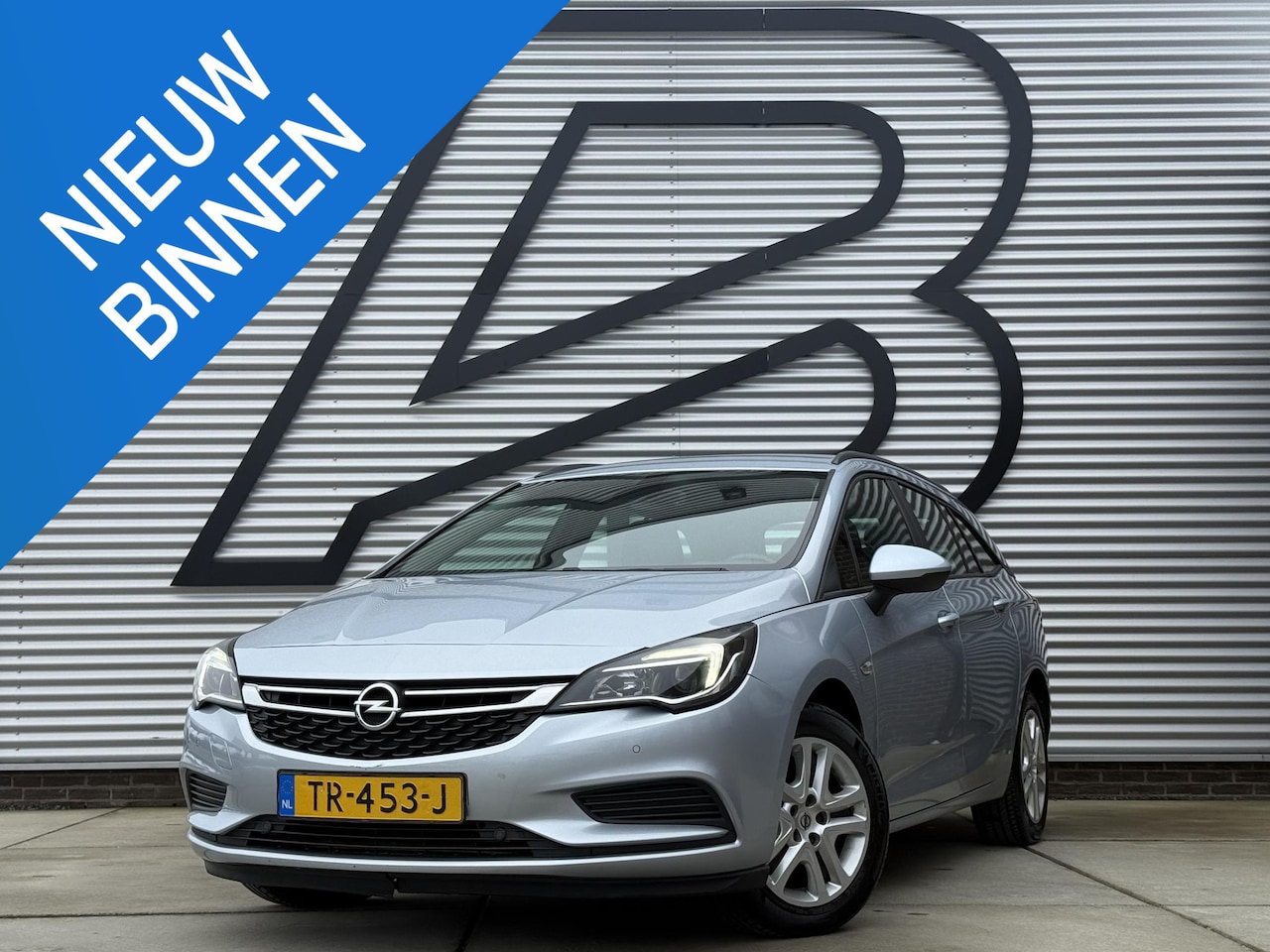 Opel Astra Sports Tourer - 1.4 Online Edition 2e Eigenaar|Navi|Trekhaak|Clima|Cruise|PDC V+A|N.A.P|APK tot 09-2026 - AutoWereld.nl