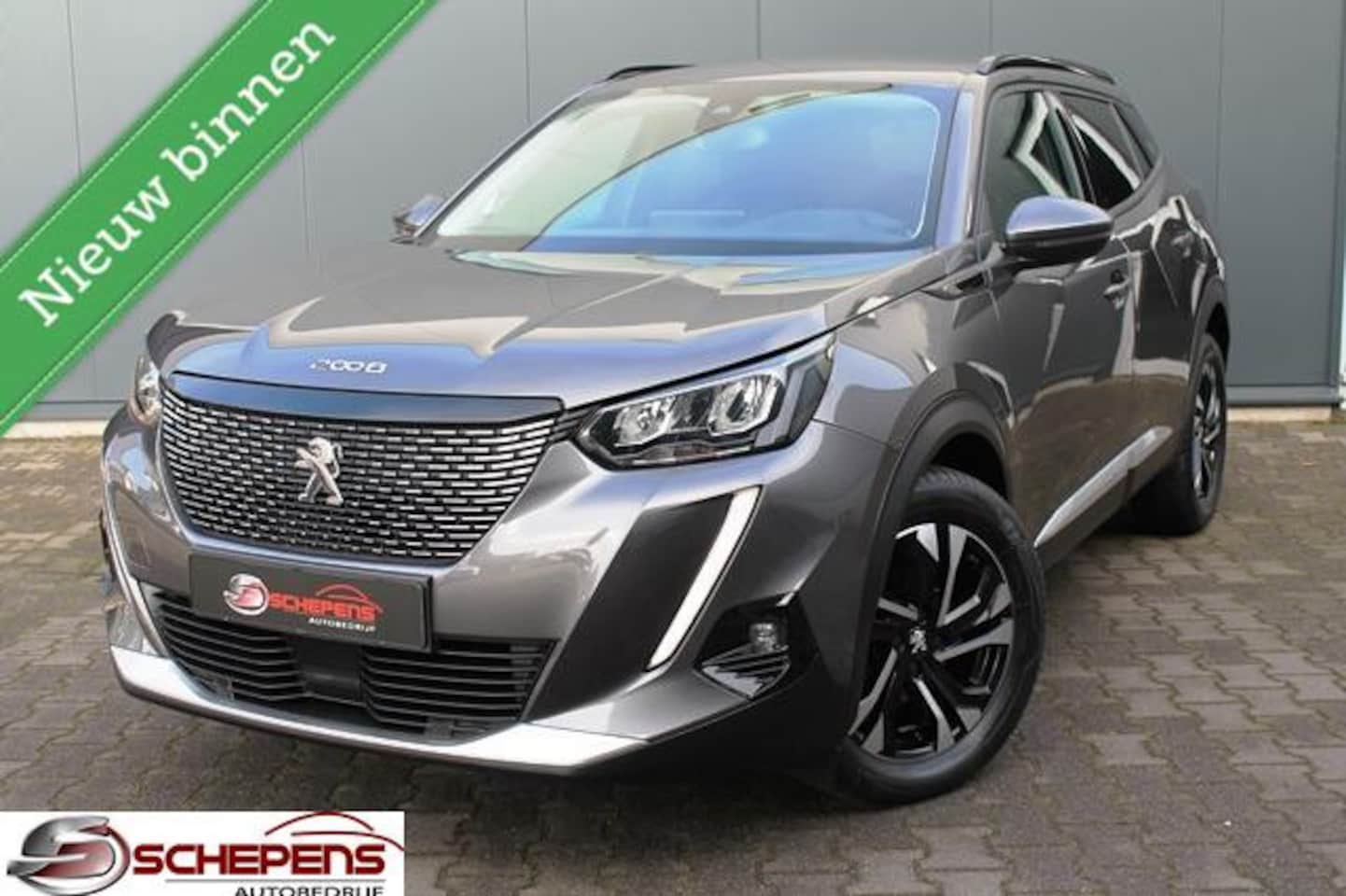 Peugeot 2008 - 1.2 PureTech Allure Road Trip | Navi | 3D Display | Camera | Trekhaak - AutoWereld.nl