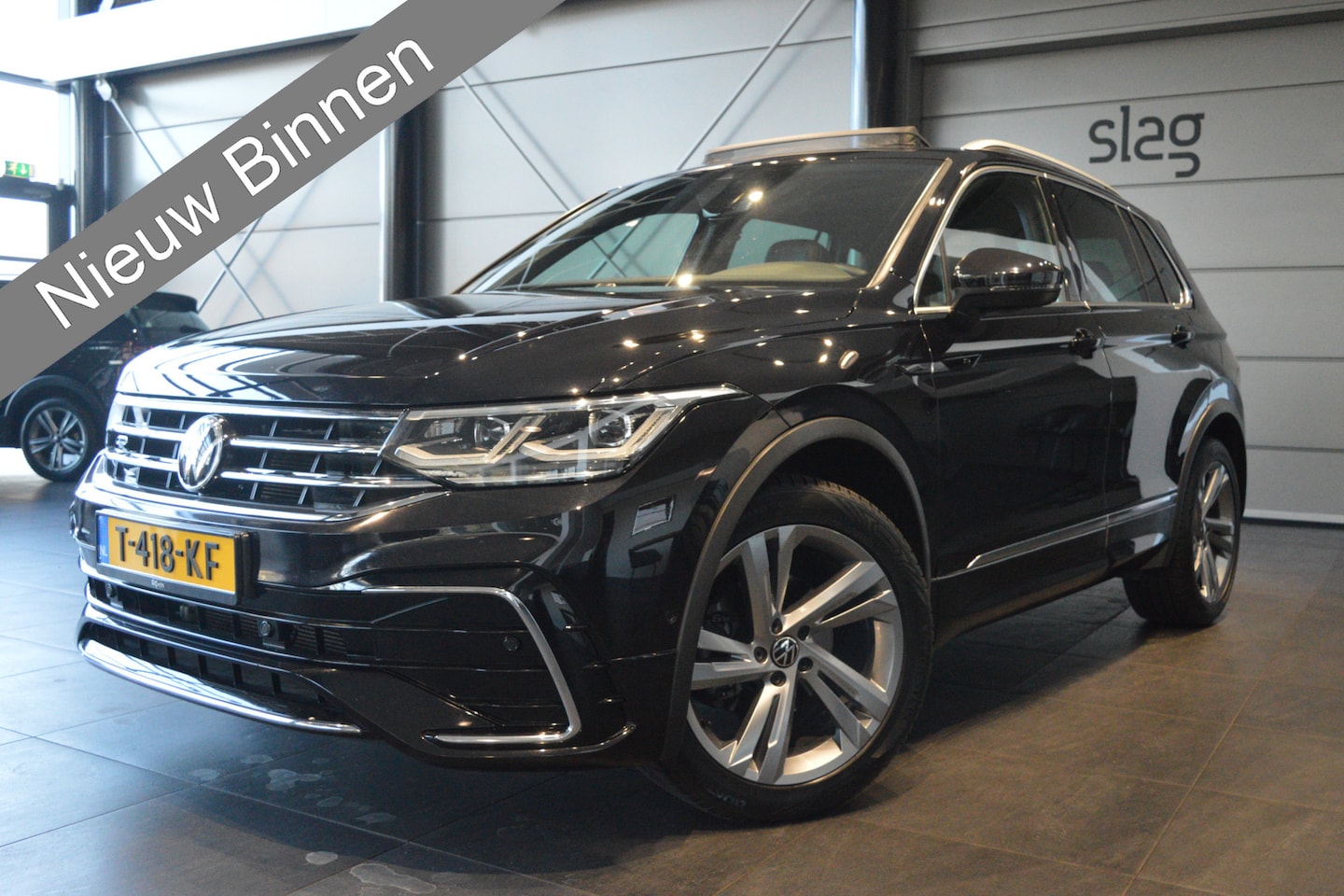 Volkswagen Tiguan - 1.5 TSI 2X R-Line navi leer keyless pano trekhaak 150 pk !! - AutoWereld.nl