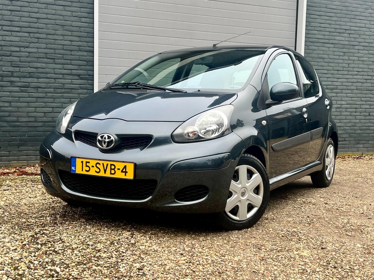 Toyota Aygo - 1.0-12V Comfort Navigator | NL AUTO | NAP | AIRCO | NAVIGATIE | TREKHAAK - AutoWereld.nl