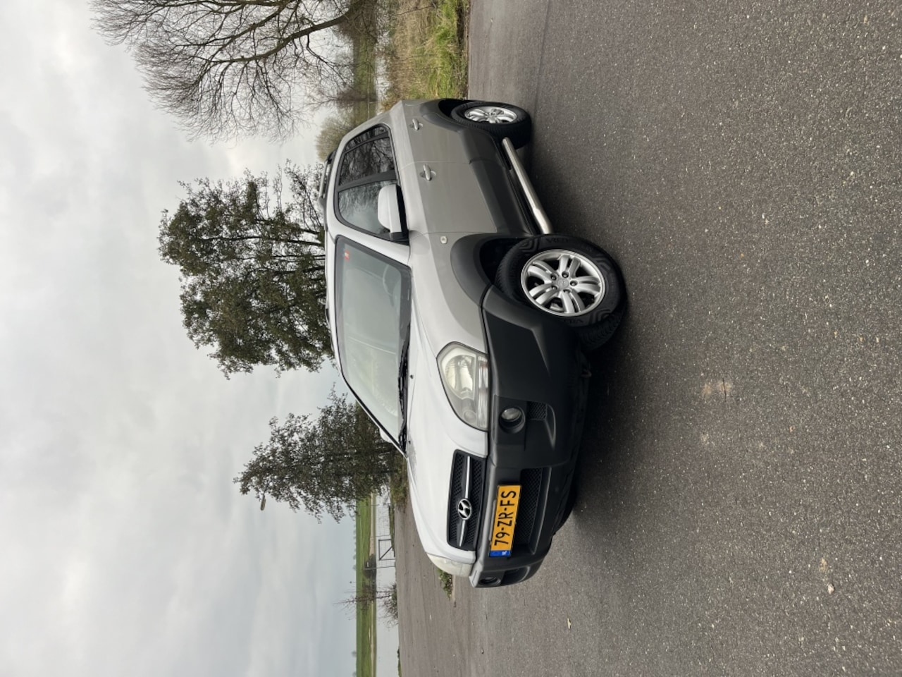 Hyundai Tucson - 2.0i Style EK - AutoWereld.nl