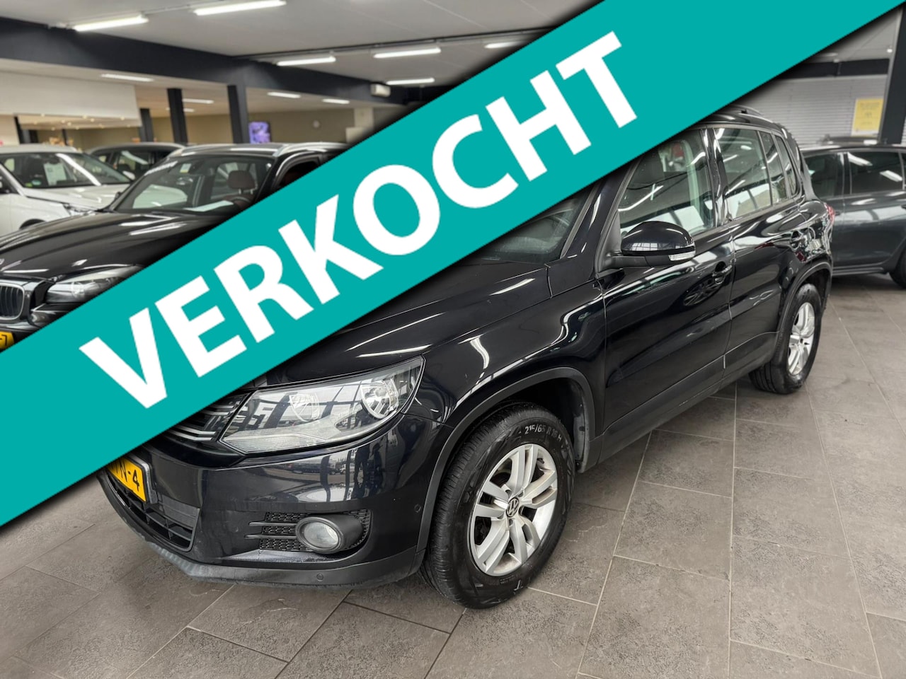Volkswagen Tiguan - 1.4 TSI Comfort&Design leer navigatie clima cruise controle lm-velgen trekhaak - AutoWereld.nl