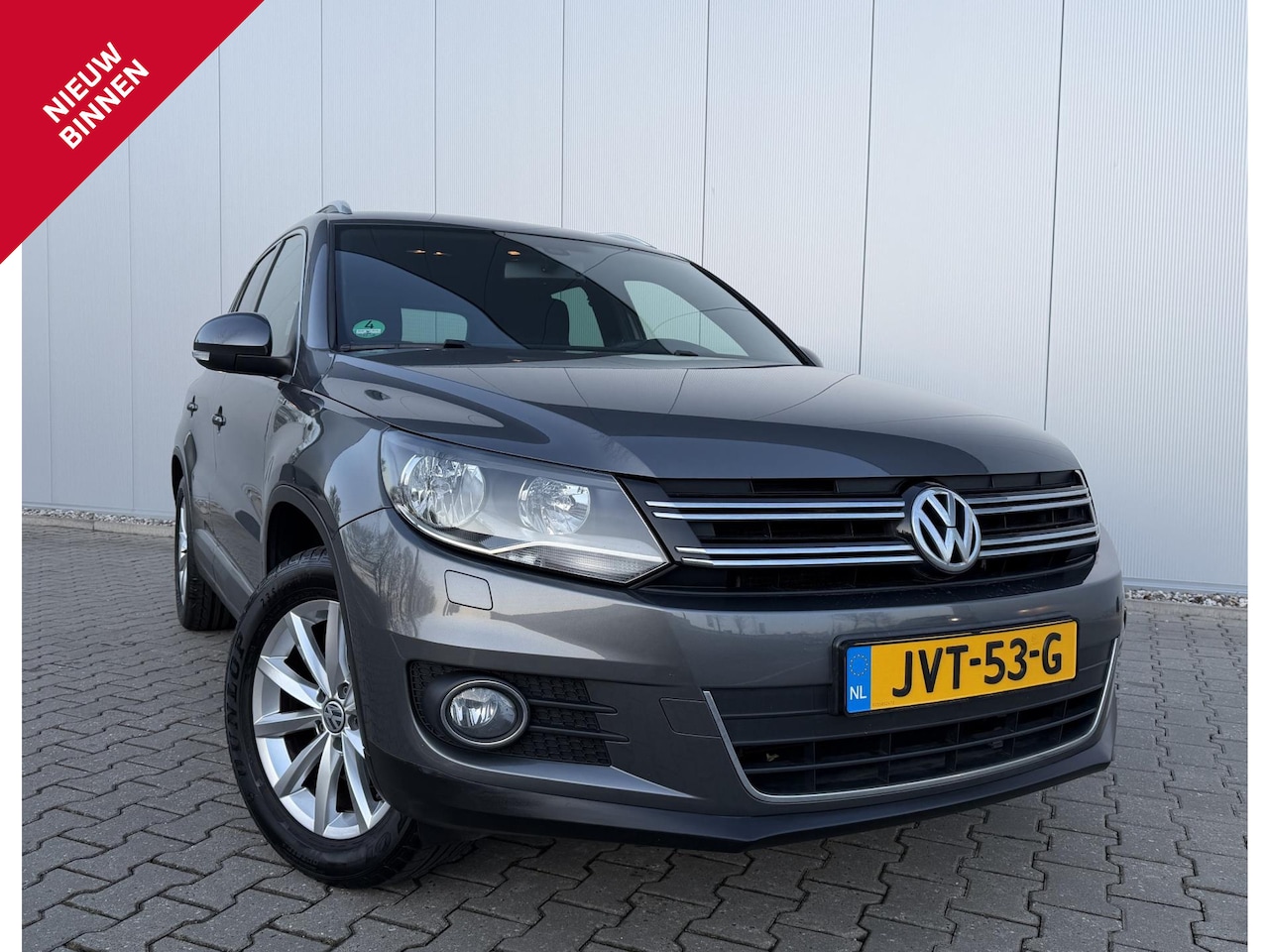 Volkswagen Tiguan - 1.4 TSI 150PK Sport&Style Cruise Dealeronderhouden - AutoWereld.nl