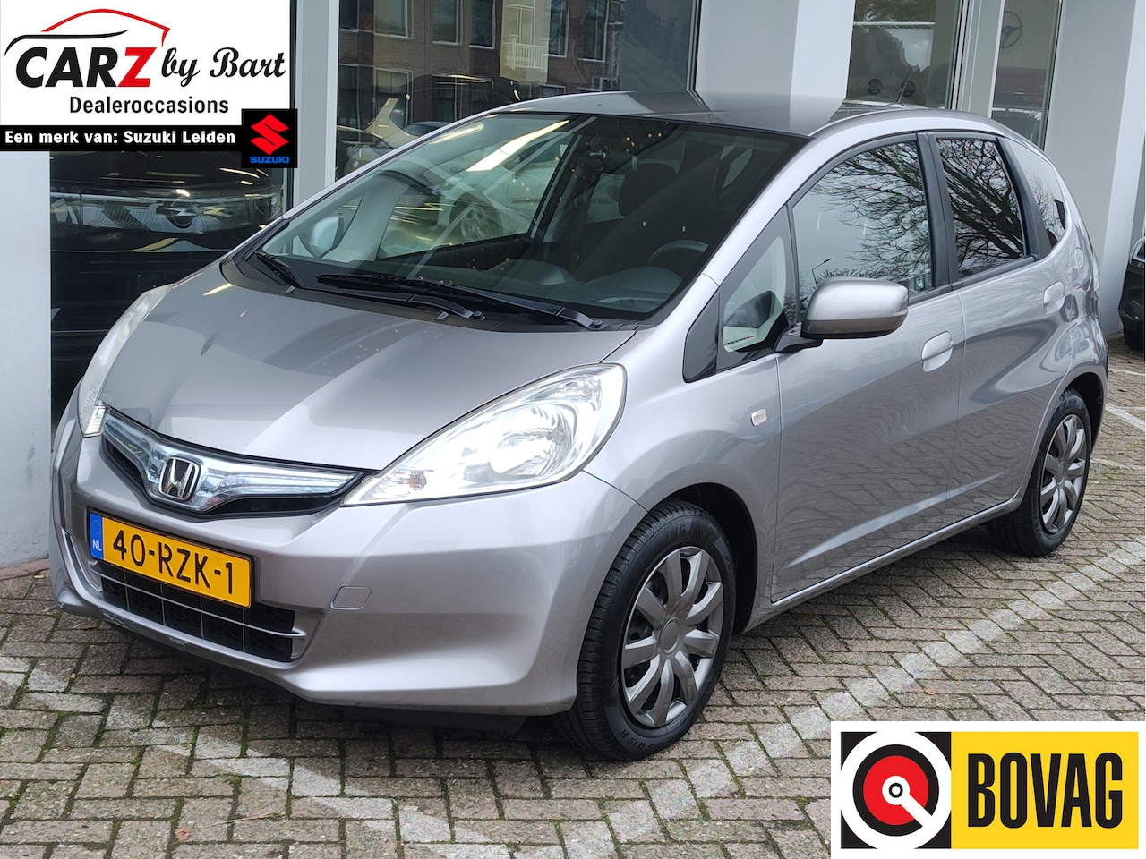 Honda Jazz - 1.4 HYBRID BUSINESS MODE AUT. Cruise | Clima | Getinte ramen - AutoWereld.nl