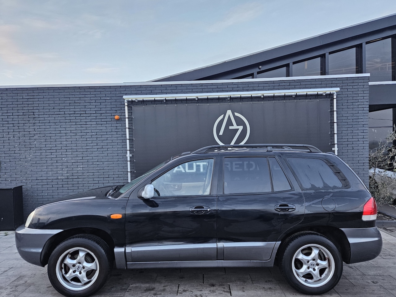 Hyundai Santa Fe - 2.4i-16V Elite *AC*Pano*Heatseat* - AutoWereld.nl