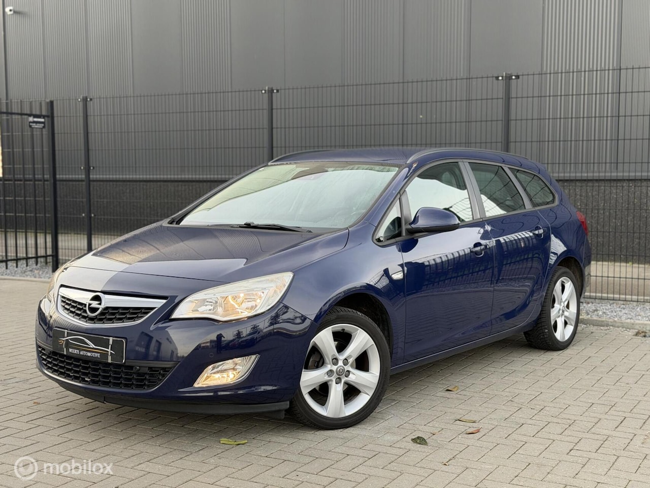 Opel Astra Sports Tourer - 1.4 Edition |AIRCO|CRUISE|TREKHAAK - AutoWereld.nl
