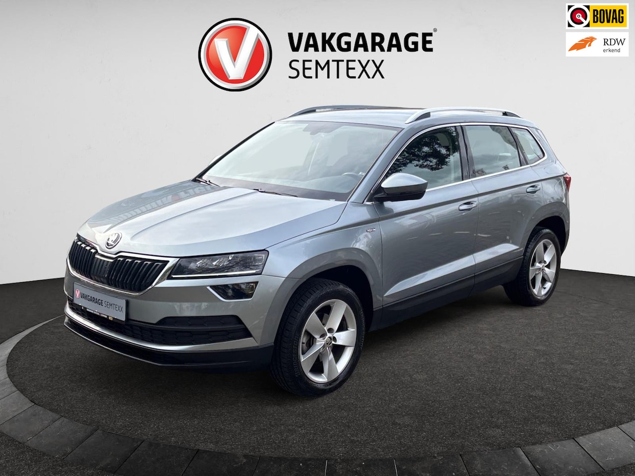 Skoda Karoq - 1.0 TSI Ambition Business | Automaat | Clima | Cruise | Dakrails | Half Leder | Stoelverw. - AutoWereld.nl