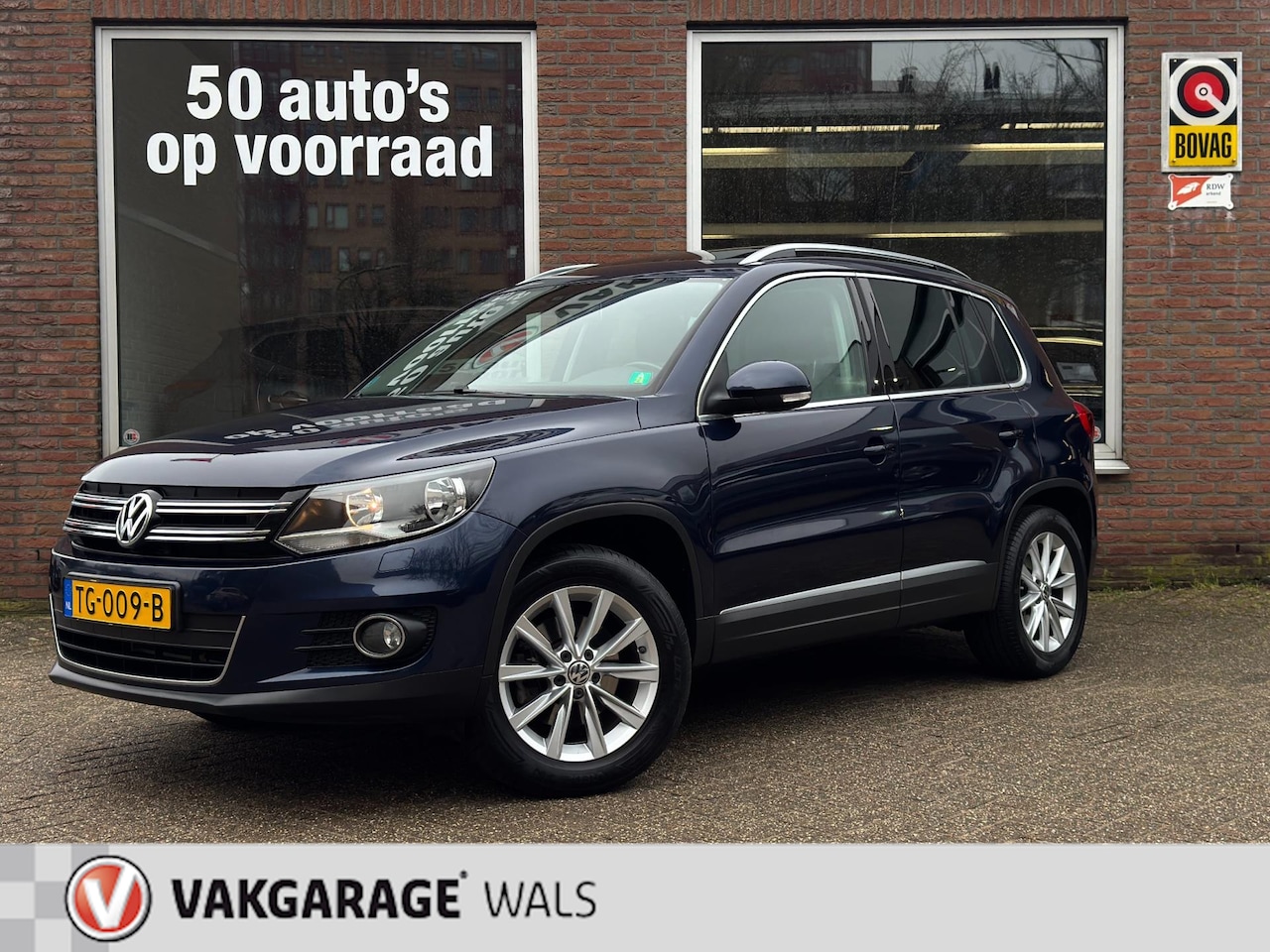Volkswagen Tiguan - 1.4 TSI Sport&Style | Airco | Navi | Pano | Stoelverwarming | Trekhaak - AutoWereld.nl