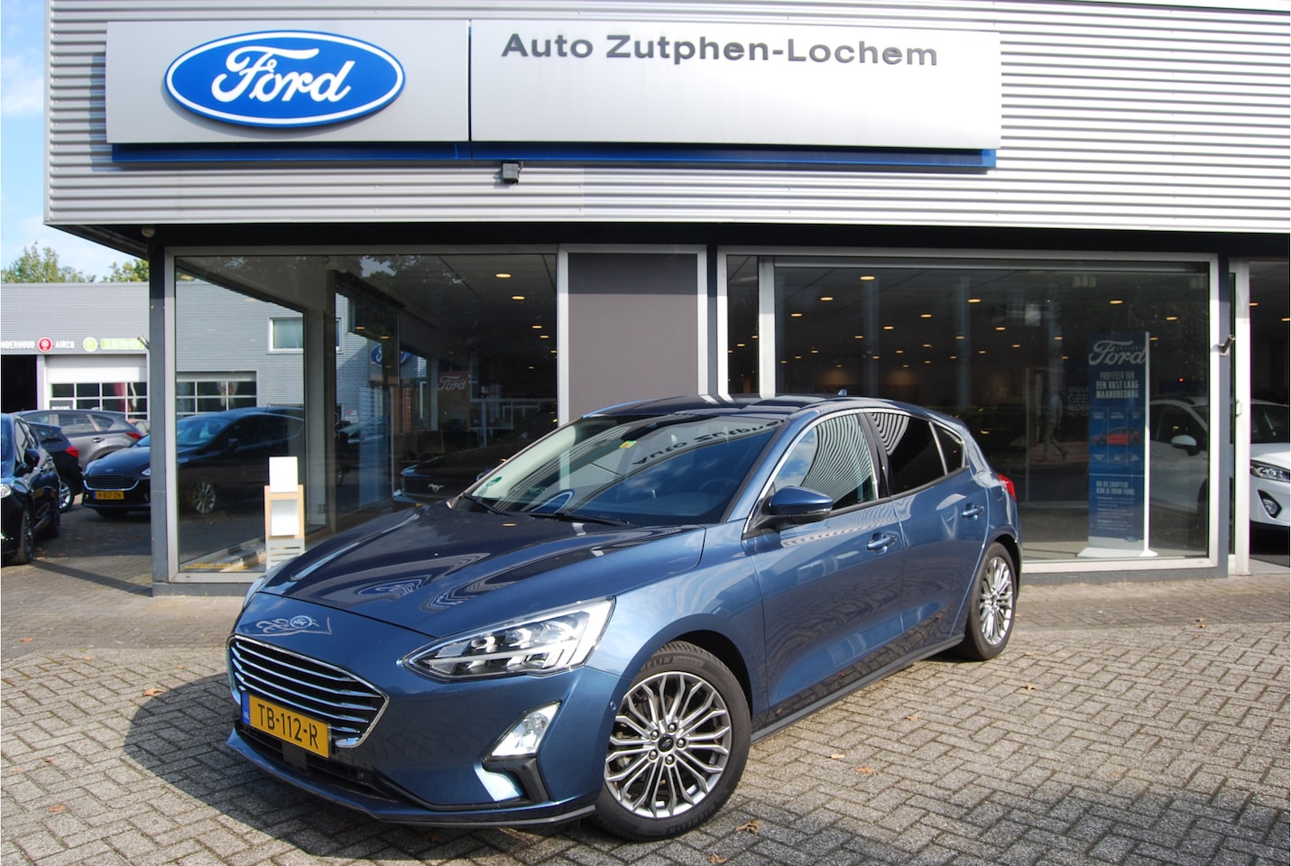 Ford Focus - 1.0 EcoBoost 125pk Titanium Business 5dr NL-AUTO | TREKHAAK | STOEL/STUUR-VOORRUITVERWARM - AutoWereld.nl