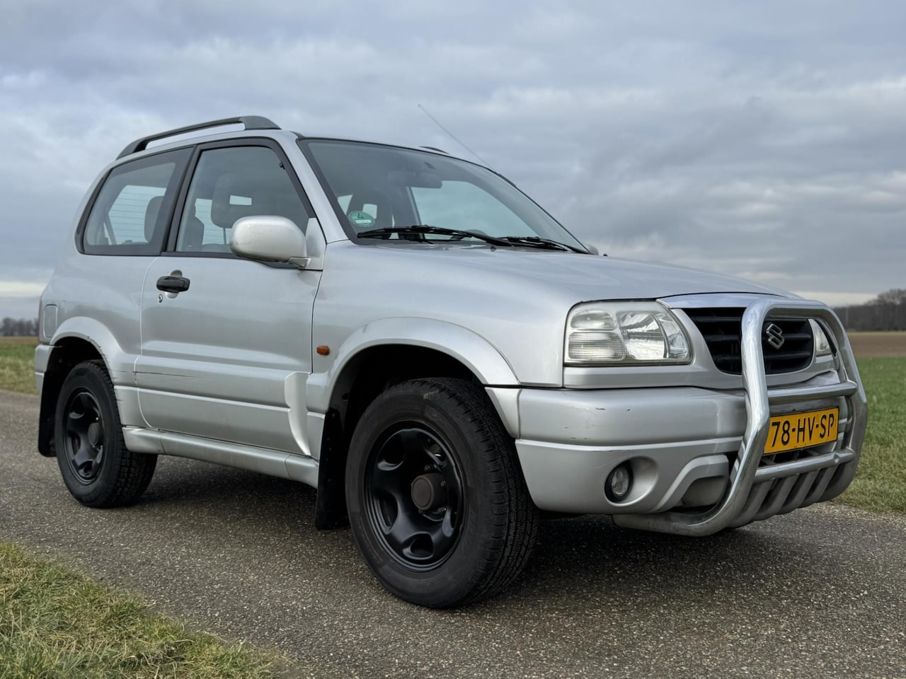 Suzuki Grand Vitara - 1.6 Metal Top Wide Body 1.6 Metal Top Wide Body - AutoWereld.nl