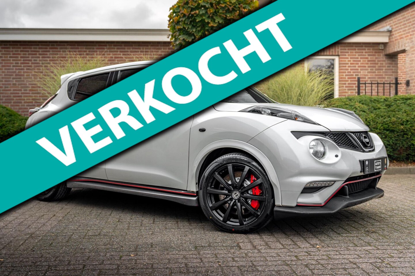 Nissan Juke - 1.6 Turbo NISMO Parelmoer Wit Camera LED Alcantara 18'' - AutoWereld.nl
