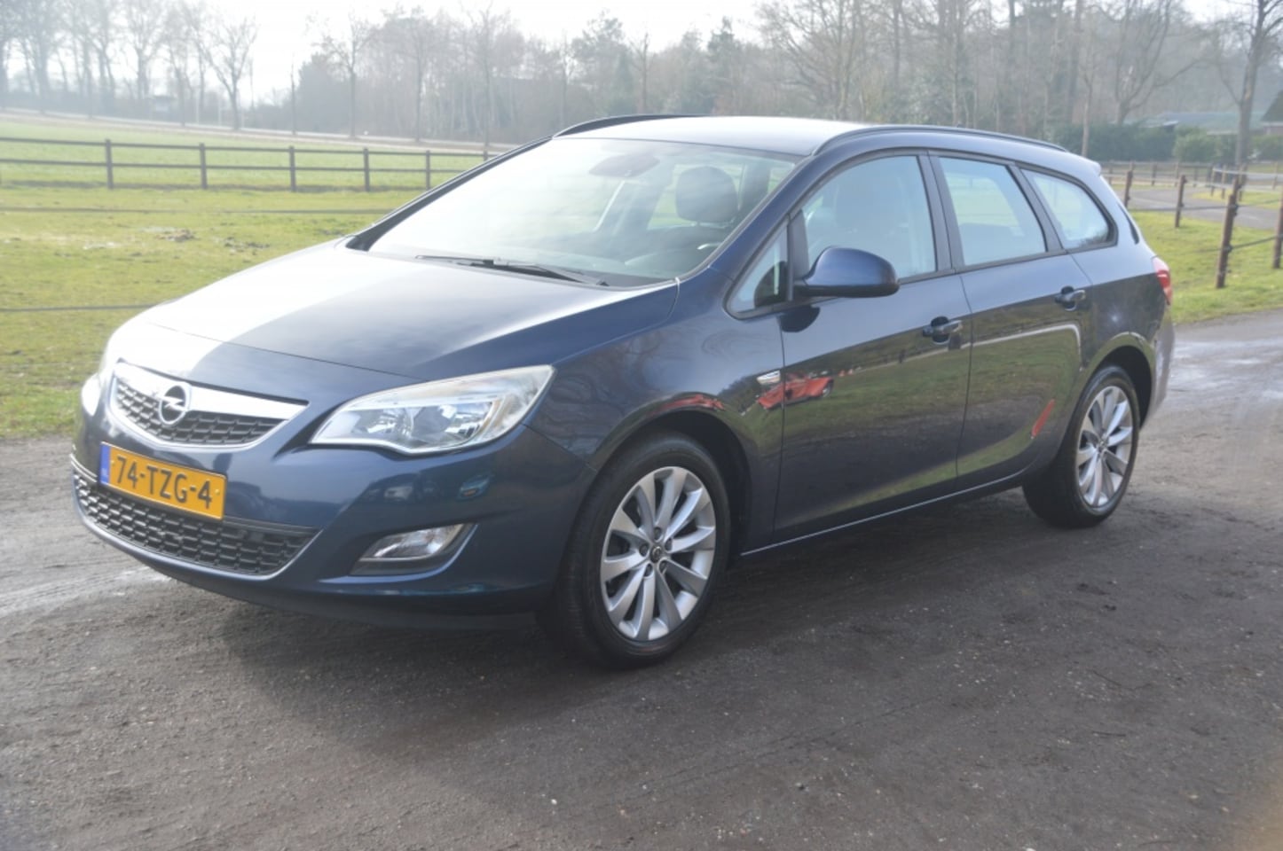 Opel Astra Sports Tourer - 1.4 Turbo Airco Cruise Navi PDC - AutoWereld.nl