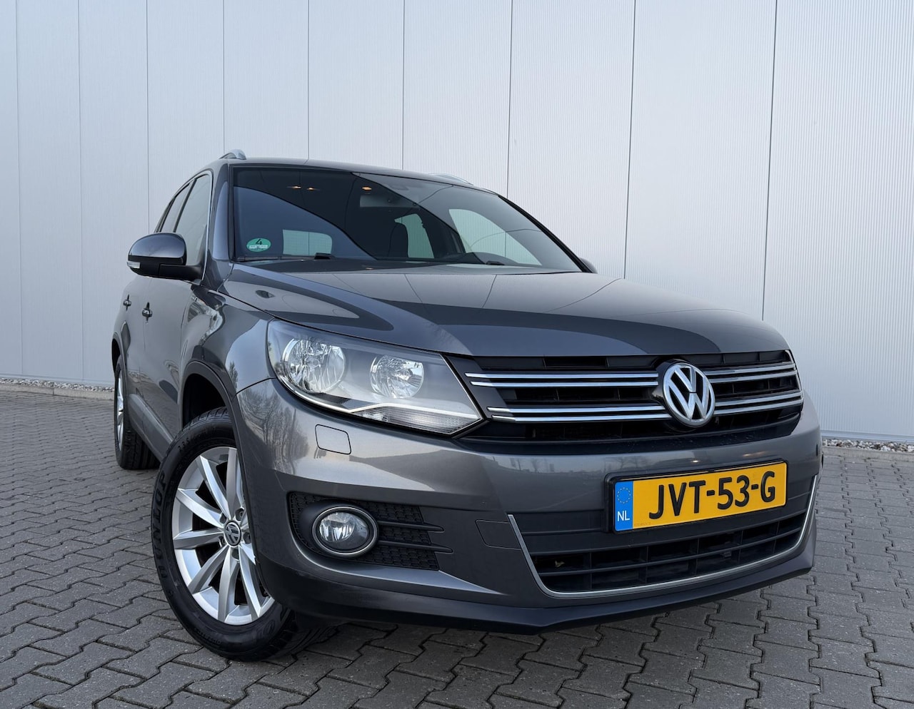 Volkswagen Tiguan - 1.4 TSI 150PK Sport&Style Cruise Dealeronderhouden - AutoWereld.nl