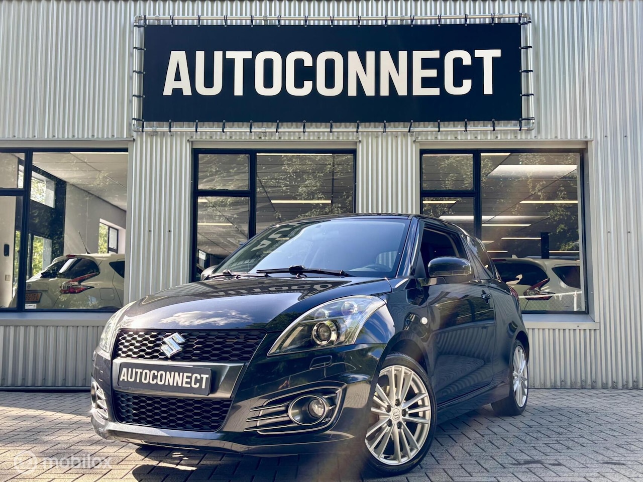 Suzuki Swift - 1.6 Sport 1.6 Sport, CRUISE, ECC/AIRCO, XENON, STOELVERW. - AutoWereld.nl
