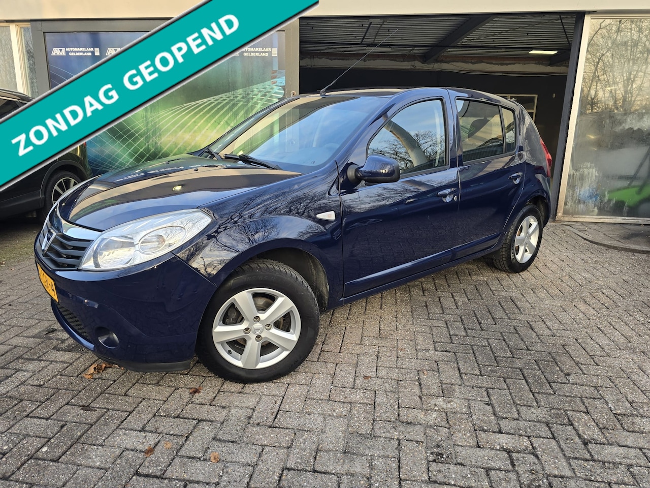 Dacia Sandero - 1.2 Lauréate LPG | NW APK | ZO MEE | AIRCO | ELEC RAMEN | LMV | - AutoWereld.nl