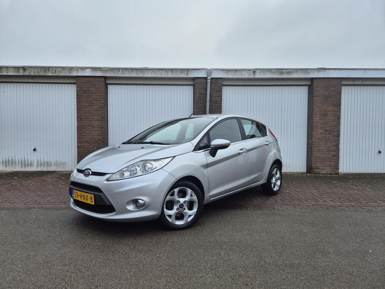 Ford Fiesta - 1.25 Titanium / Origineel NL / Airco / Verwarmde voorruit - AutoWereld.nl