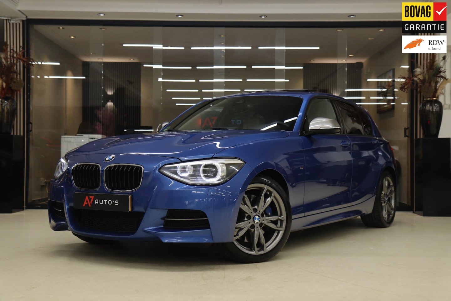 BMW 1-serie - M135i xDrive High Executive M PANO/CARPLAY/LEER/H&K/BOMVOL - AutoWereld.nl