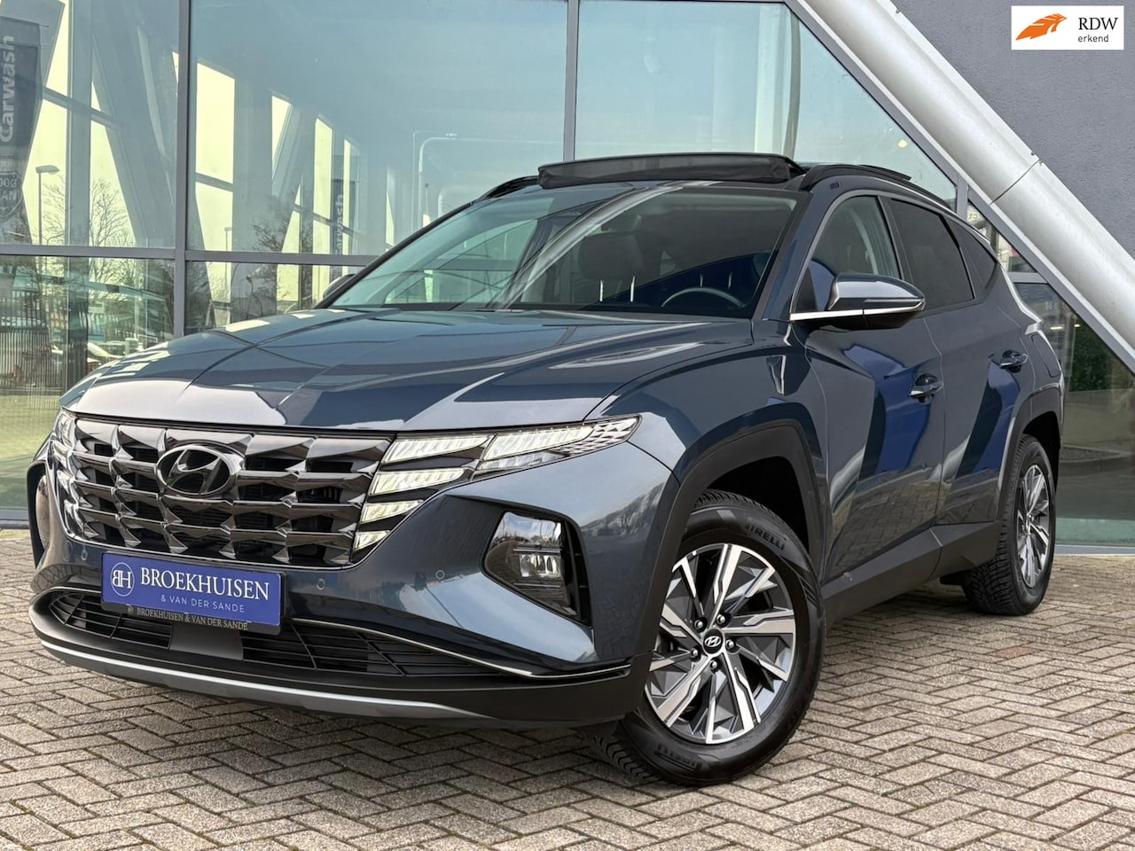 Hyundai Tucson - 1.6 T-GDI HEV Comfort Smart 230pk Panoramadak / Camera / Stoelverwarming - AutoWereld.nl