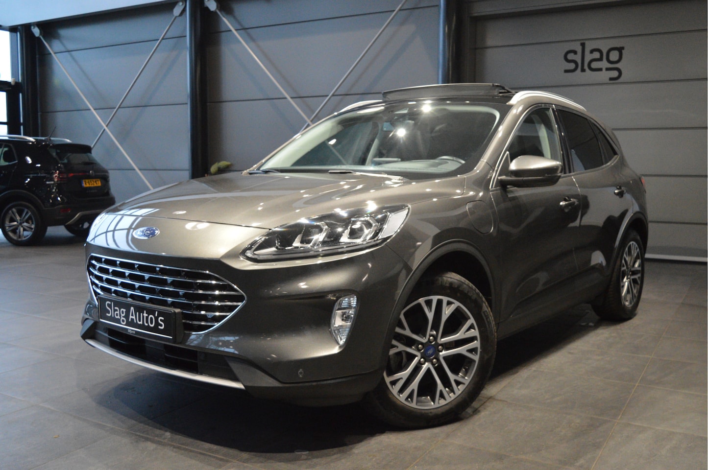Ford Kuga - 2.5 PHEV Titanium X navi pano head up trekhaak 18 inch !! - AutoWereld.nl