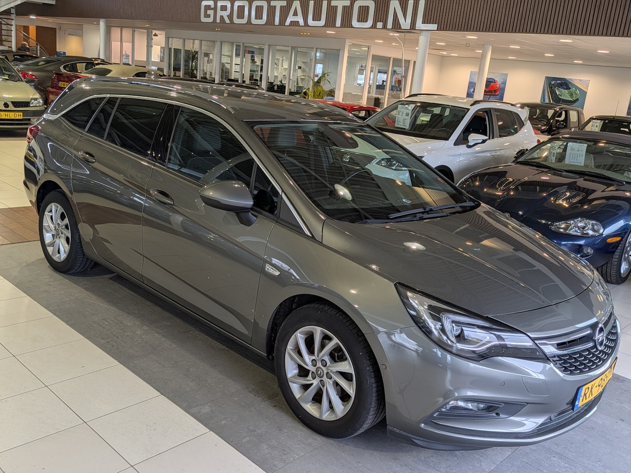 Opel Astra Sports Tourer - 1.0 Innovation Airco, Cruise Control, Trekhaak, Stuurbekrachtiging - AutoWereld.nl