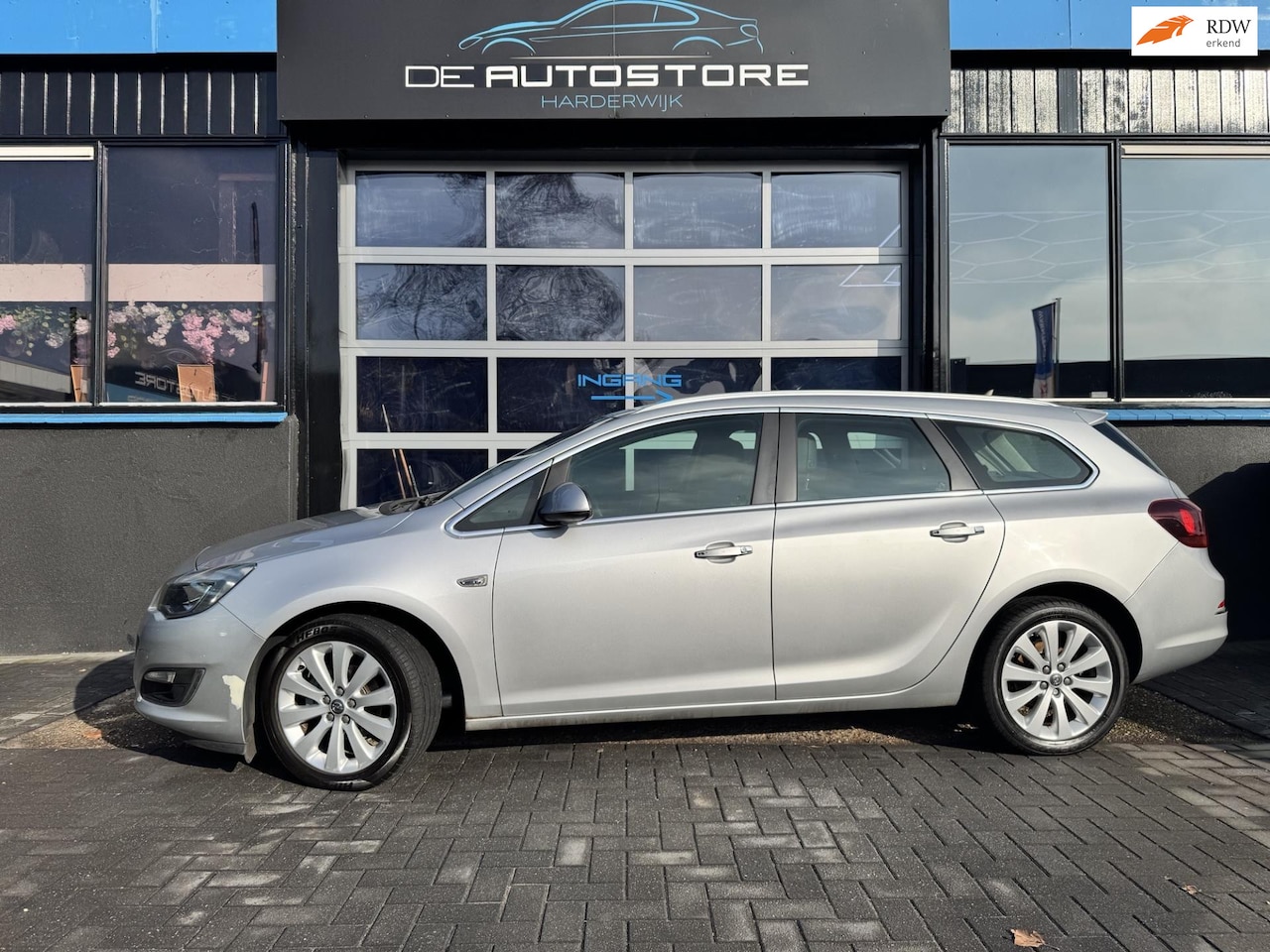 Opel Astra Sports Tourer - 1.4 Turbo Sport Airco navi Cruise R Camera pdc - AutoWereld.nl