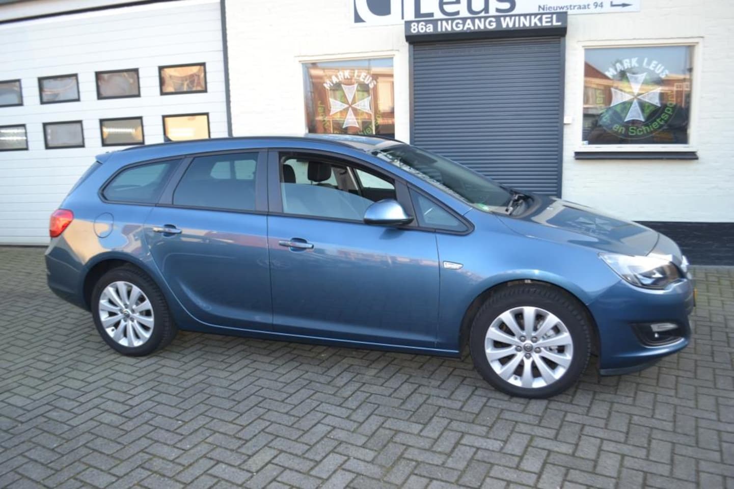 Opel Astra Sports Tourer - 1.4 Turbo Sport + De Duurdere Uitvoering - AutoWereld.nl