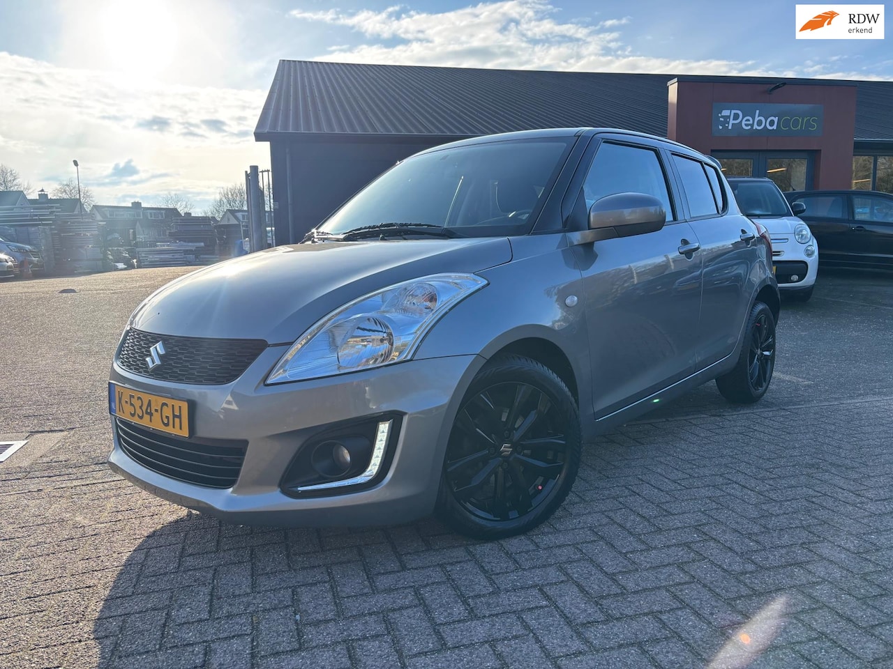Suzuki Swift - 1.2 Bandit EASSS / Airco / Cruise control / L.m velgen - AutoWereld.nl