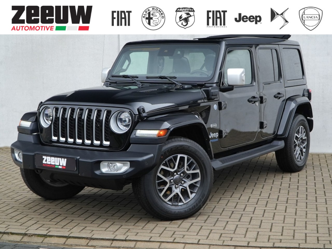 Jeep Wrangler Unlimited - 4xe 380 PK Sahara | Leder | Soft Top | Overland | Camera | 18" - AutoWereld.nl