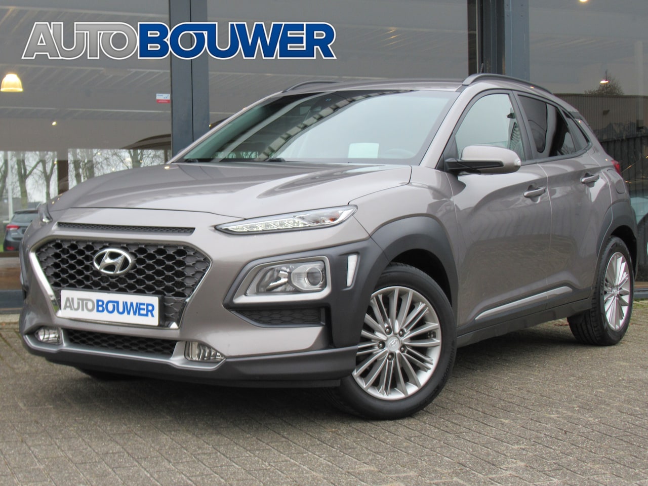 Hyundai Kona - 1.0 T-GDI 120 PK Premium 2e eigen | navi | elektr.stoelen | head up display | camera | key - AutoWereld.nl