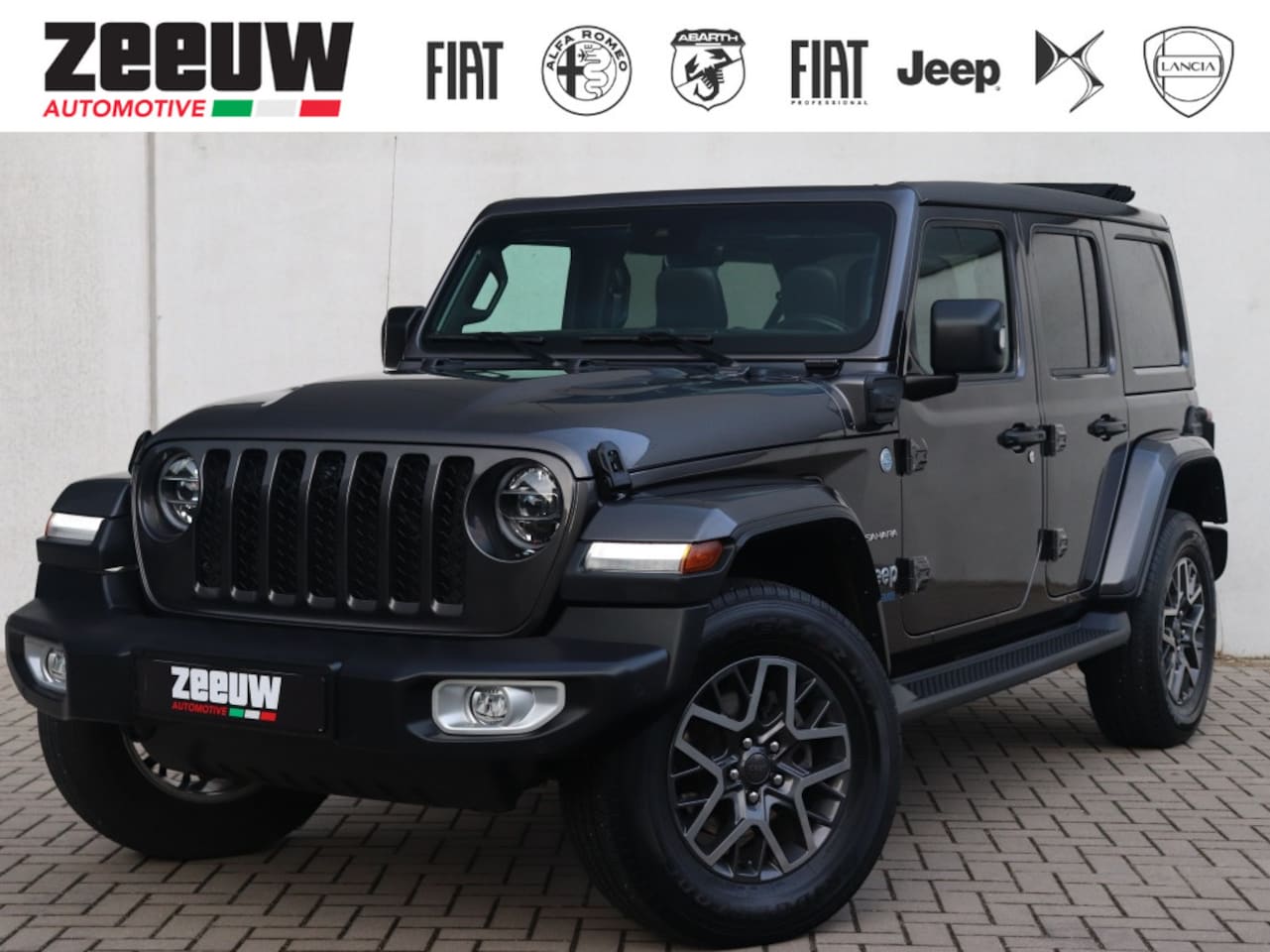Jeep Wrangler Unlimited - 4xe 380 PK Sahara | Leder | Soft Top | Camera | 18" - AutoWereld.nl