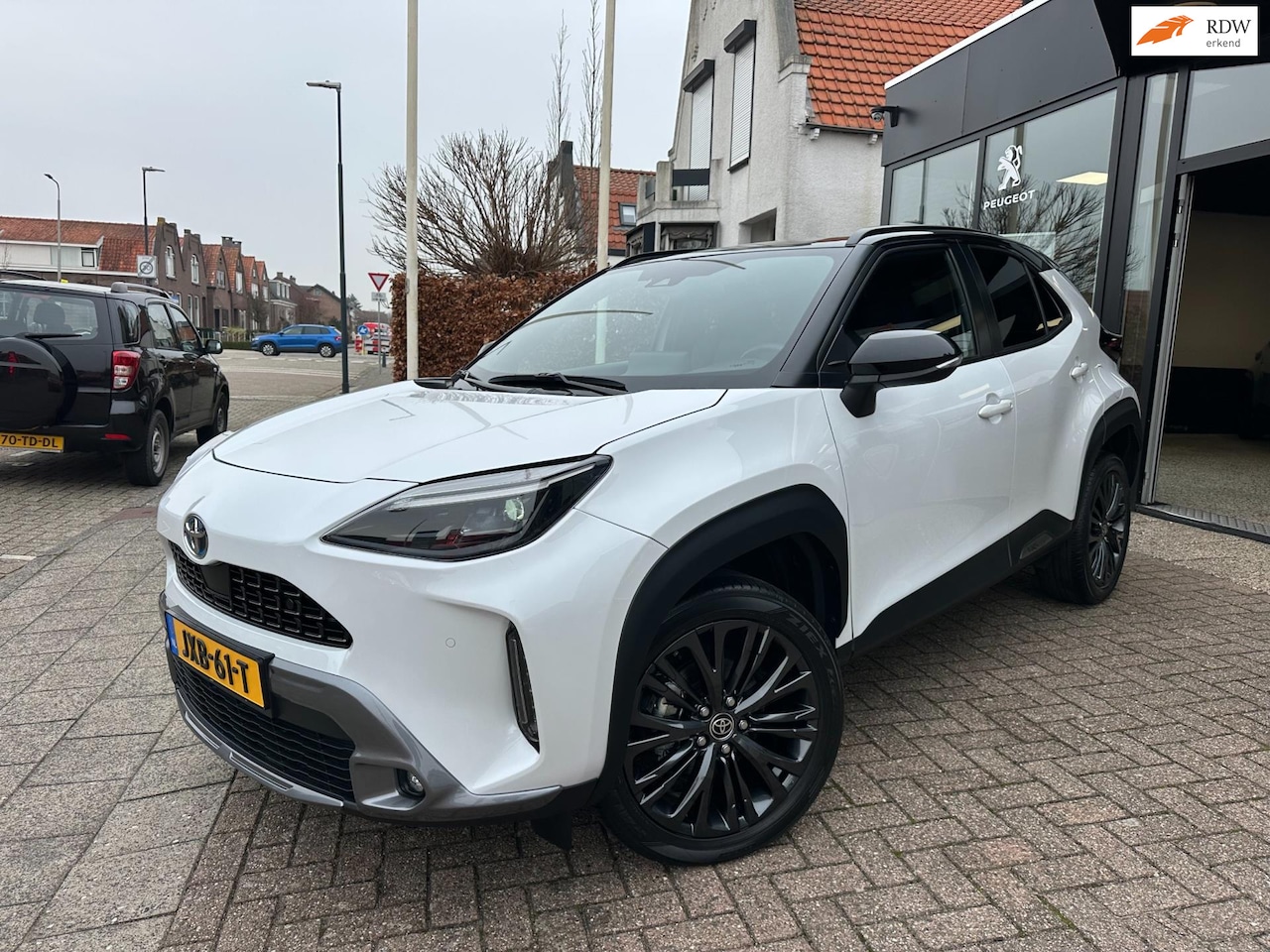 Toyota Yaris Cross - 1.5 Hybrid Adventure|Bi-Tone|Half Leder|18" LM velgen - AutoWereld.nl
