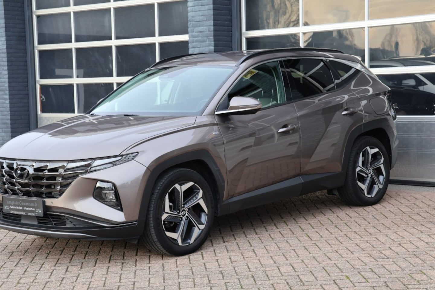 Hyundai Tucson - 1.6 T-GDI MHEV 150 pk navigatie,camera, Leder - AutoWereld.nl