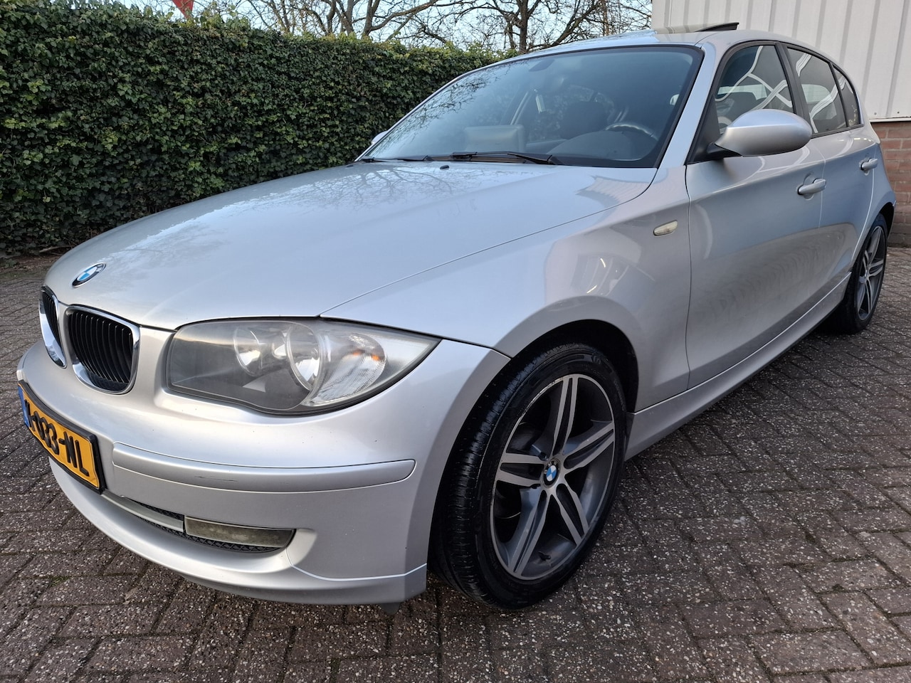 BMW 1-serie - 116i CLIMAT/CRUISE/NAVI/ZONNEDAK/PDC.A 122PK - AutoWereld.nl