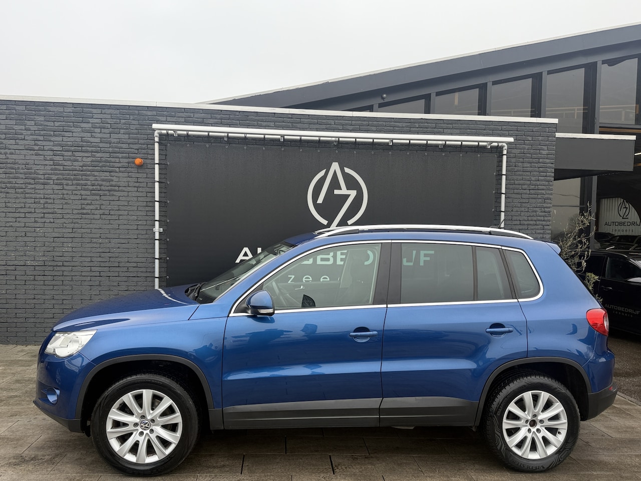Volkswagen Tiguan - 2.0 TSI Sport&Style 4Motion Panorama dak*Navi*Grootscherm - AutoWereld.nl