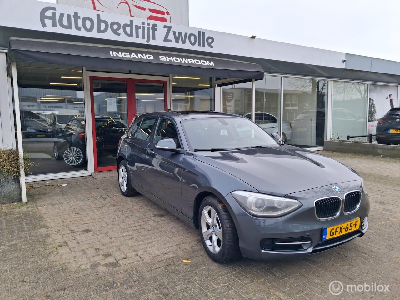 BMW 1-serie - 116i BUSINESS+ SPORT|NIEUWSTAAT|2012|NAVI||DAKJE - AutoWereld.nl