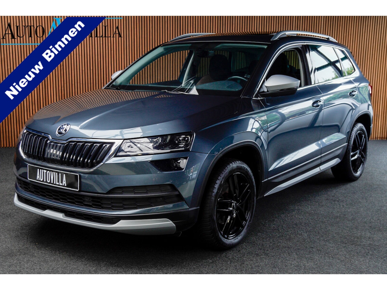 Skoda Karoq - 1.5 TSI ACT Scout Panodak Navi Virtual Stoelverwarming Cruise PDC LM velgen - AutoWereld.nl