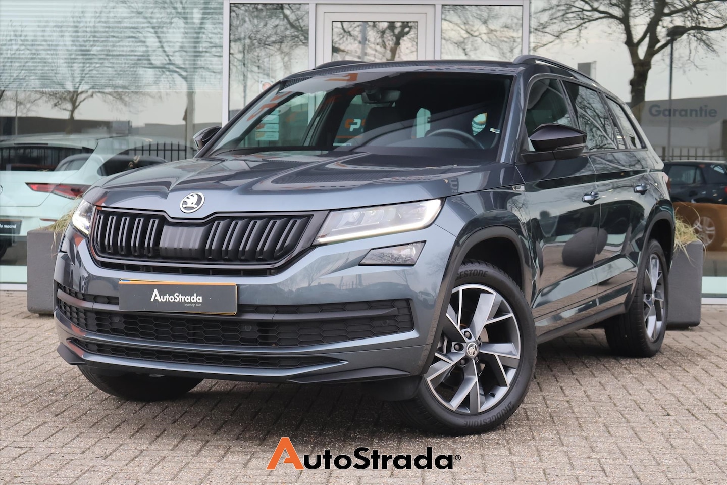 Skoda Kodiaq - 1.5 SportLine TSI ACT 150pk | 7 Persoons | Stoelverwarming | Camera | Virtual | Trekhaak | - AutoWereld.nl