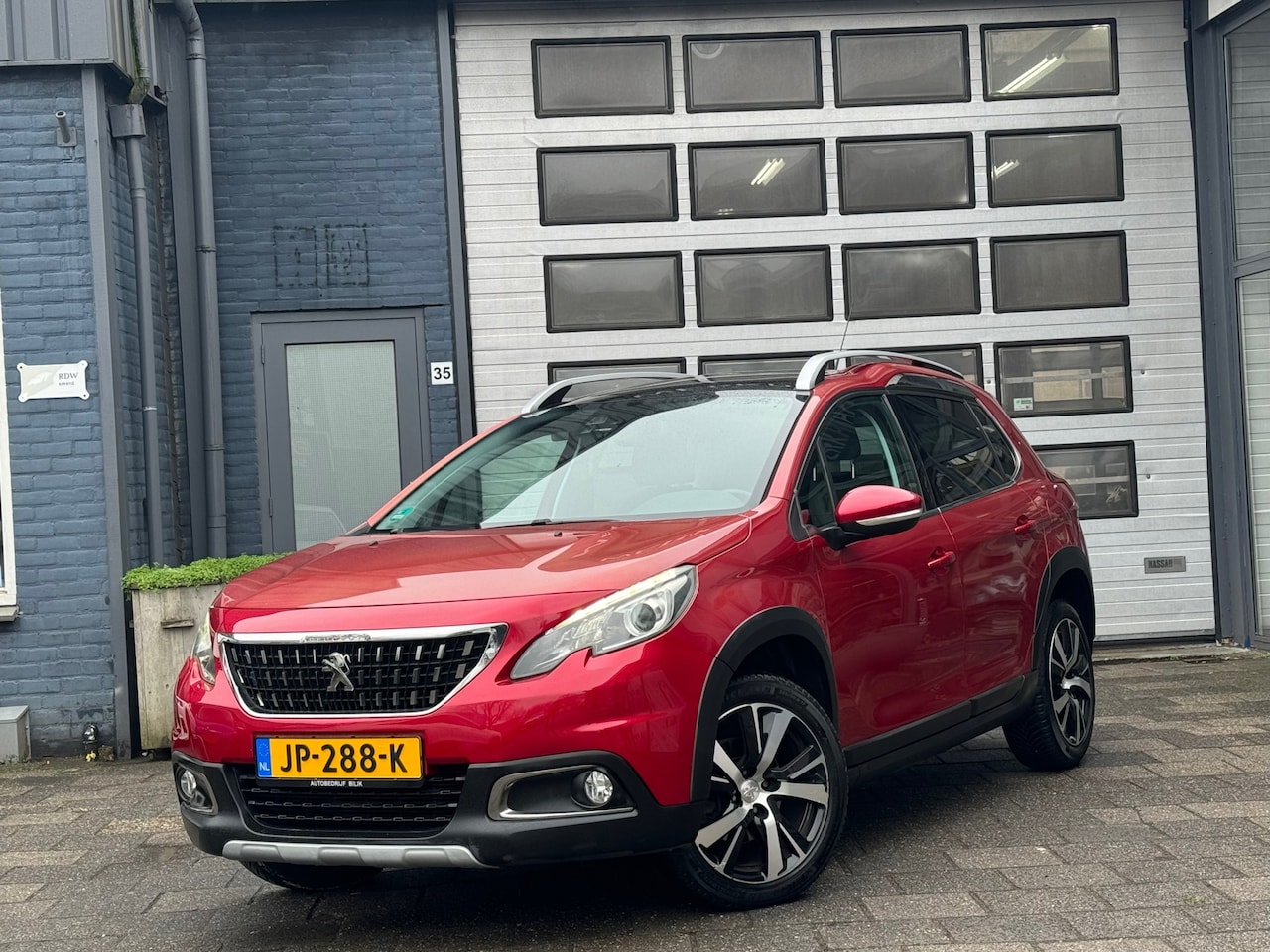 Peugeot 2008 - 1.2 PureTech Allure | Clima | Navi | Leer | Pano - AutoWereld.nl