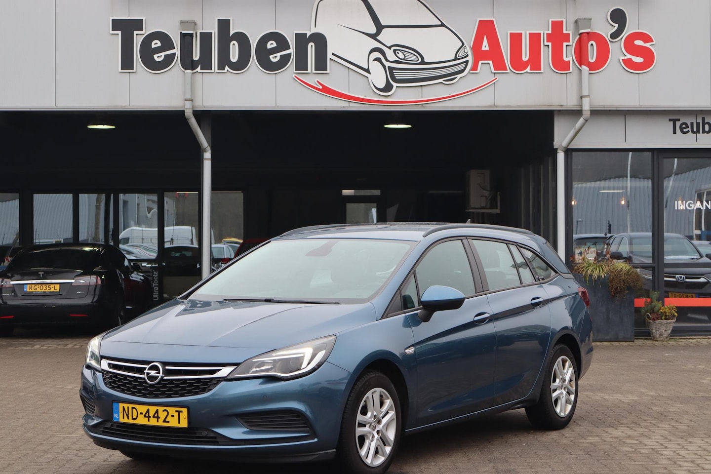 Opel Astra Sports Tourer - 1.4 Edition Navigatie, Airco, Cruise control, Camera, Trekhaak - AutoWereld.nl