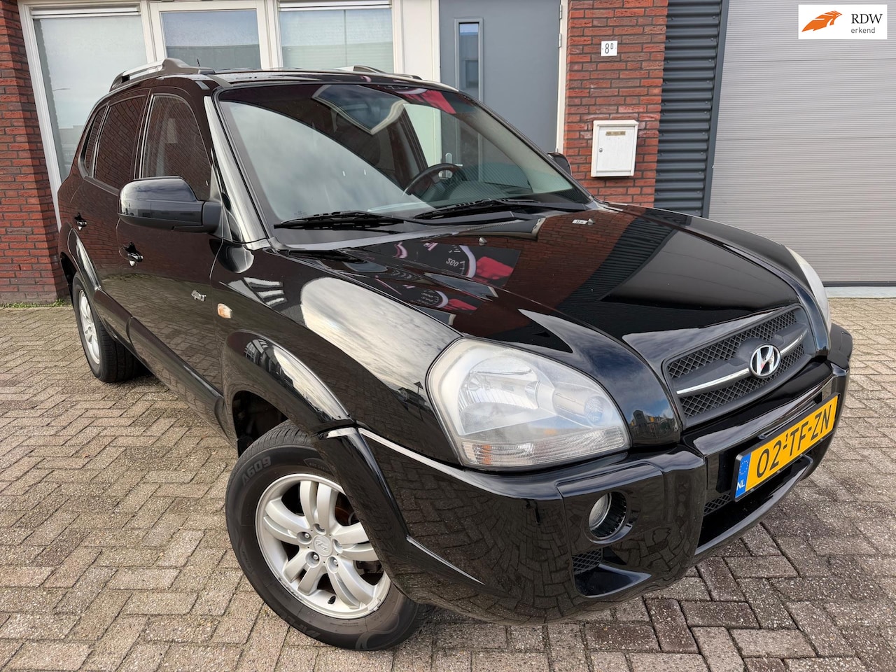 Hyundai Tucson - 2.7i V6 4WD Style / Navi / Leder / Cruise / AUT / Schermpje / Cruise - AutoWereld.nl