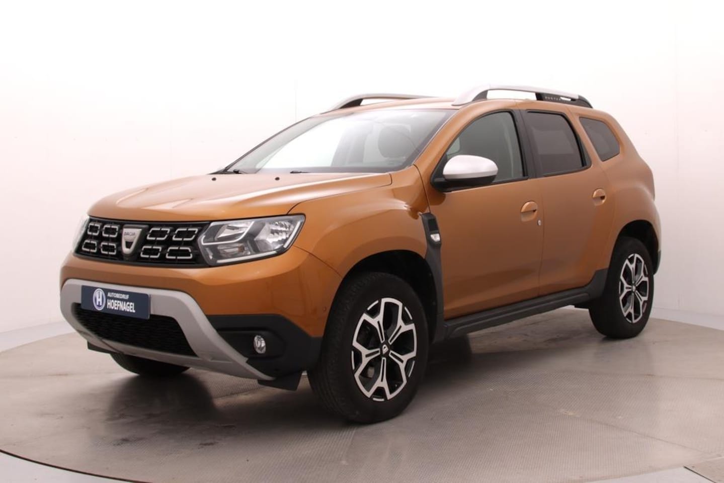 Dacia Duster - 1.3 TCe Prestige | Trekhaak | Camera | Parkeersensoren | Cruise Control | Stoelverwarming - AutoWereld.nl