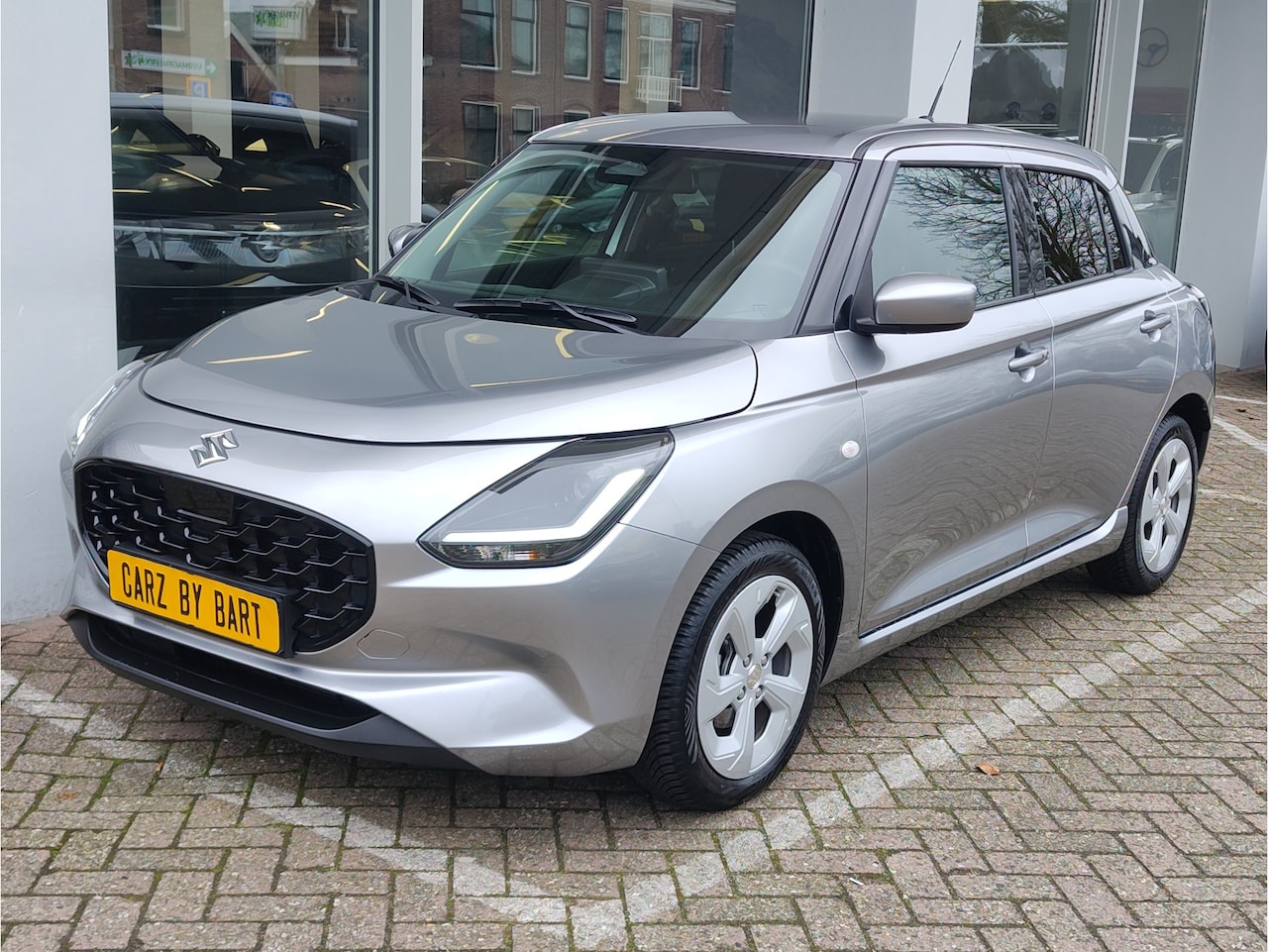 Suzuki Swift - 1.2 SELECT SMART HYBRID Draadloze Carplay | Dodehoeksens. | Navi | Stoelverw. - AutoWereld.nl