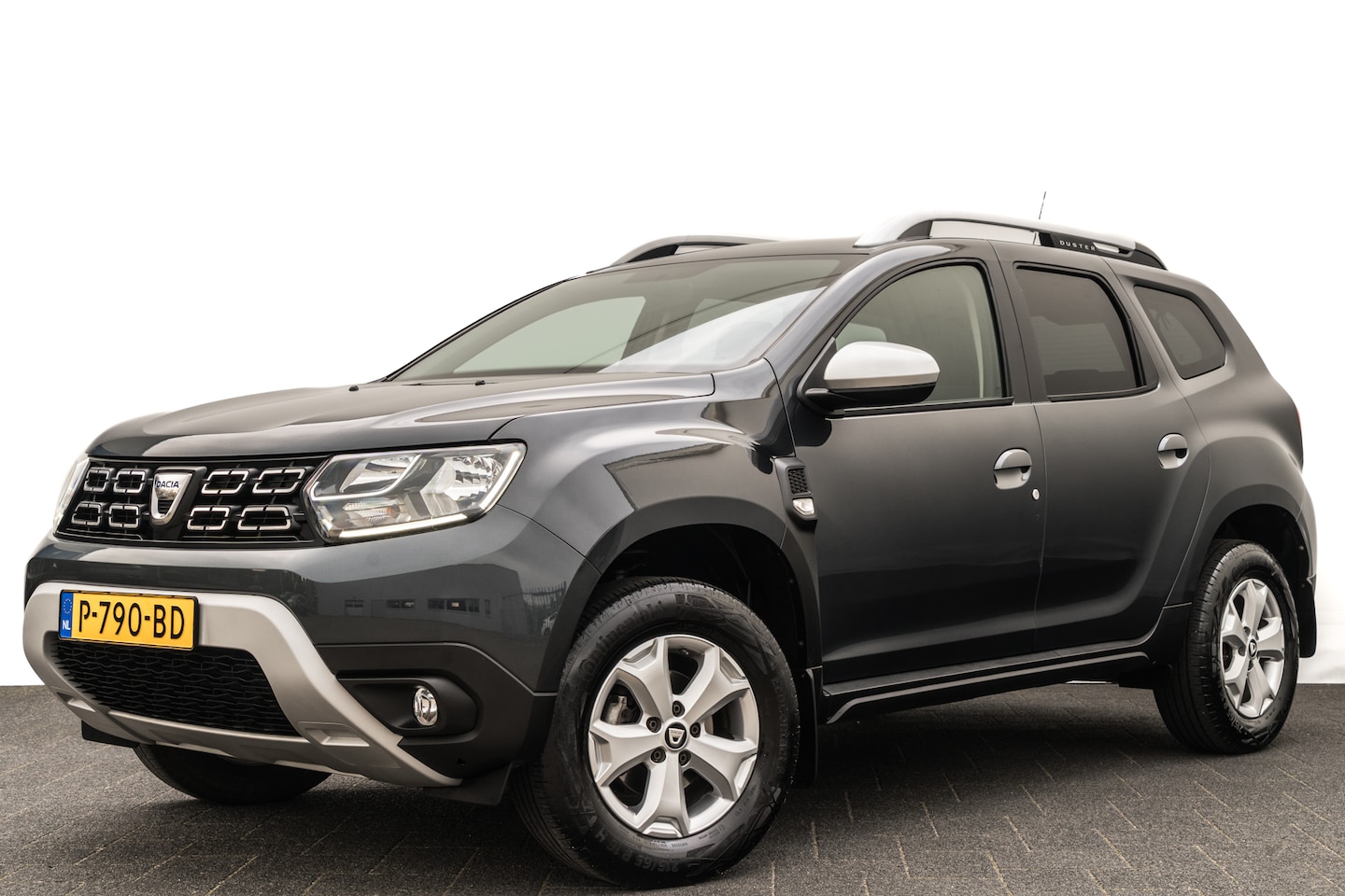 Dacia Duster - 1.0 TCe Comfort | 26.711 Kilometer | Trekhaak | Cruise | Stoelverwarming | PDC | Airco - AutoWereld.nl