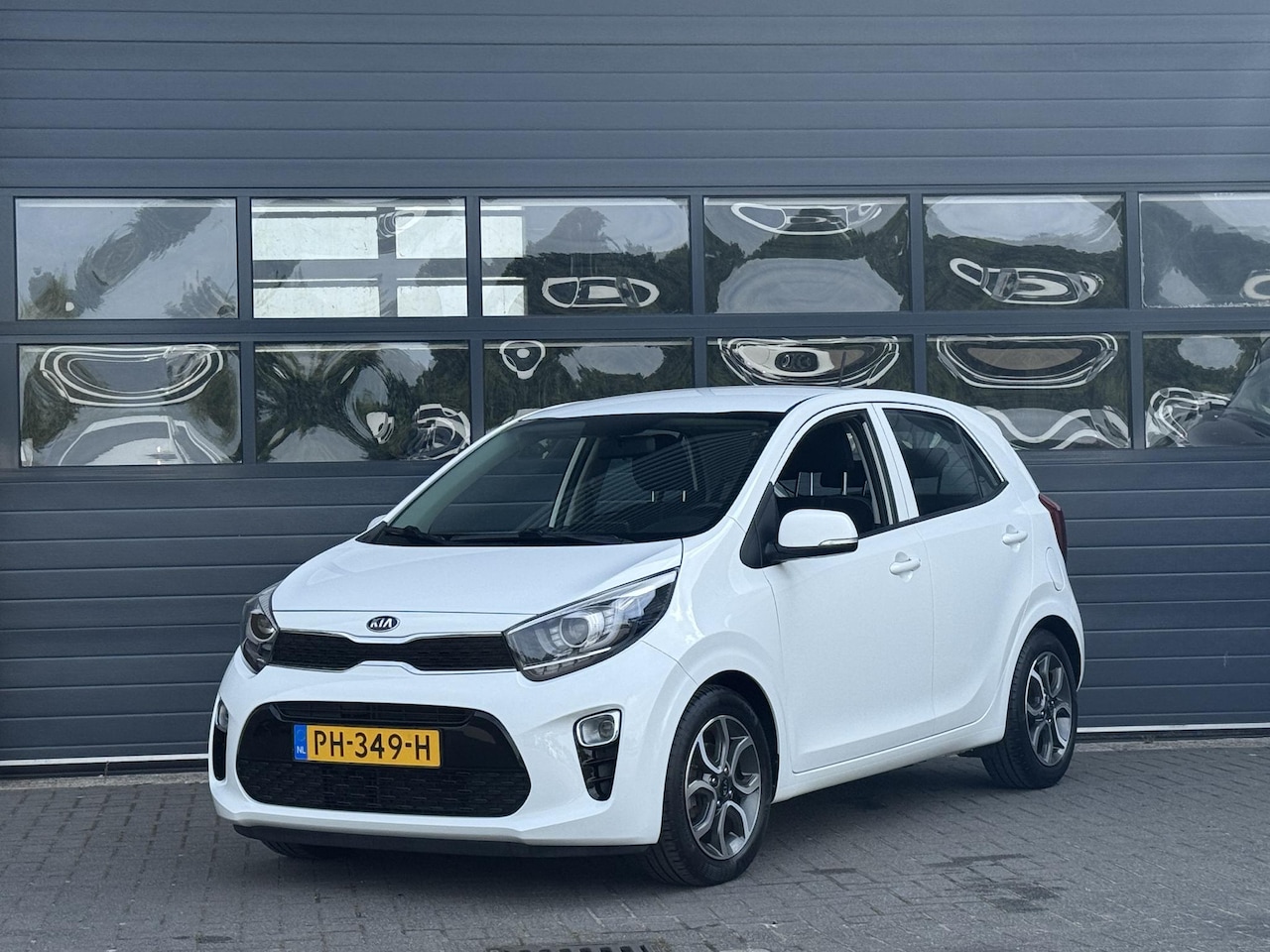 Kia Picanto - 1.0 CVVT FIRST EDITION I CRUISE CONTROL I NAVIGATIE I LICHT METALEN VELGEN I AIRCONDITIONI - AutoWereld.nl