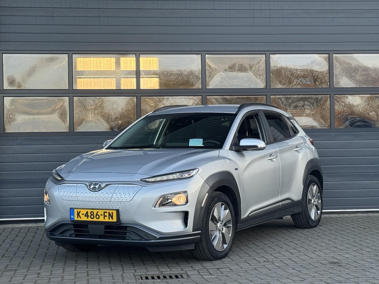 Hyundai Kona Electric - EV FASHION 64 KWH I 3 FASE I 100% SOH I P-CAMERA I AUTOMAAT I APPLE CARPLAY - AutoWereld.nl