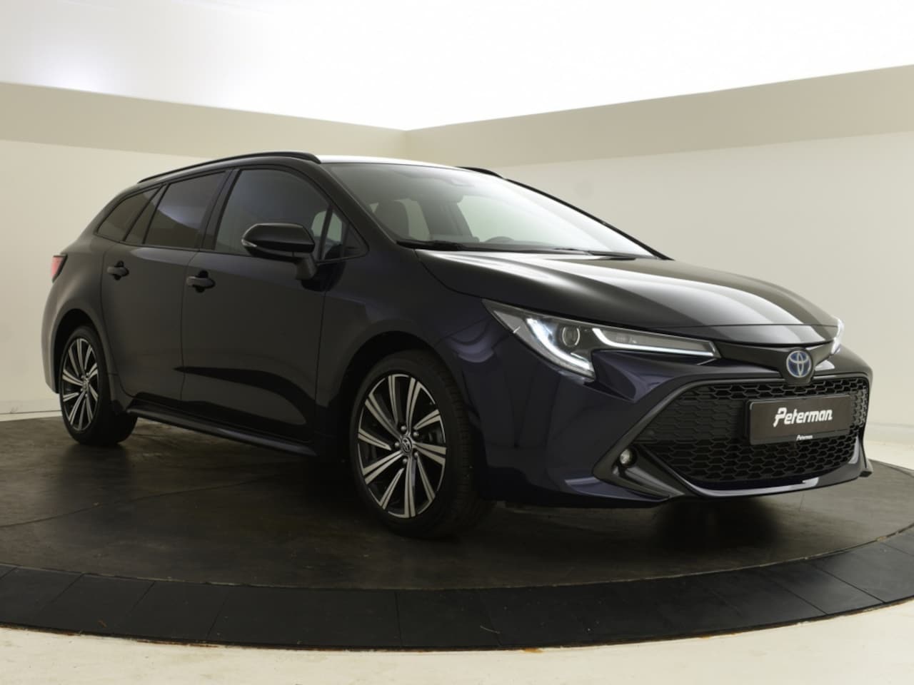 Toyota Corolla Touring Sports - 1.8 Hybrid Bi Tone | Keyless | HUD | Elektr. Achterklep - AutoWereld.nl
